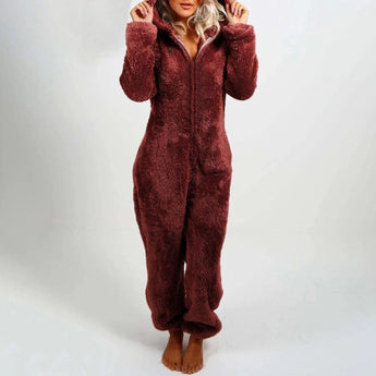 A woman wearing a burgundy 5XL fleece hooded onesie, showcasing the cozy winter jumpsuit with sleeves, a collar, and a waist design.