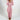 Woman wearing a light pink, 5XL, grey fleece hooded onesie, showcasing the cozy winter jumpsuit with full sleeves and a front zipper closure.