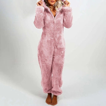 Woman wearing a light pink, 5XL, grey fleece hooded onesie, showcasing the cozy winter jumpsuit with full sleeves and a front zipper closure.