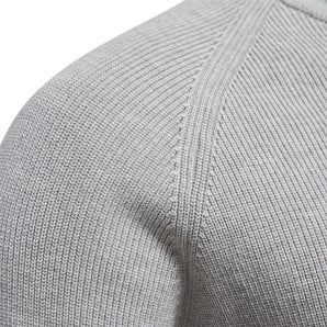 Grey knit winter beanie made of soft, breathable, textured fabric, displayed against a plain background.
