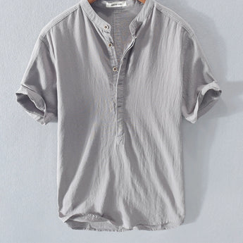 Grey linen button-up shirt in size XL, featuring a breathable and sustainable design perfect for summer fashion, with a classic collar and long sleeves.