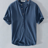 Blue linen button-up shirt featuring a collar and button details, designed for summer fashion with breathable and sustainable materials, shown in size XL.
