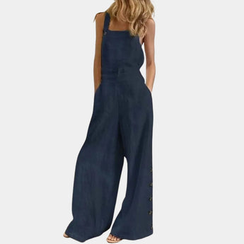 A woman wearing blue 3XL utility overalls with adjustable straps and pockets, featuring a one-piece design with a focus on the waist and thigh areas.