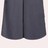 Grey women's utility overalls with adjustable straps and pockets.