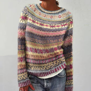 Handmade multicolor wool sweater for women featuring blue and green knit patterns, designed as a pullover. The sweater has a cozy collar and long sleeves, showcasing intricate woolen craftsmanship in a blend of colors suitable for creative and stylish outerwear.