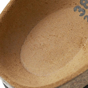 Handmade textured ceramic bowl in rustic brown and beige tones, perfect for serving food, showcasing a circular shape and artisanal earthenware design.