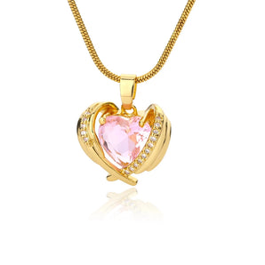 Heart-shaped pink gemstone gold necklace with diamond-encrusted heart pendant on a delicate chain.