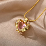 Heart-shaped pink gemstone gold necklace adorned with diamond-encrusted heart pendant.