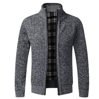 Men's heavyweight high-neck knit sweater in dark gray, featuring a multi-color design with long sleeves. The sweater is styled to resemble outerwear with a high neck and a cozy, warm texture suitable for colder weather. The dark gray color gives it a versatile and sophisticated appearance.