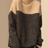 
A woman wearing a khaki, oversized wool blend sweater with a high-neck chevron pattern, showcasing long sleeves and a comfortable fit suitable for winter fashion.