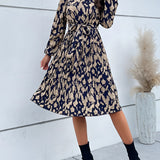 High-neck long sleeve leopard print dress showcasing trendy fall fashion with a fitted waist and stylish design.
