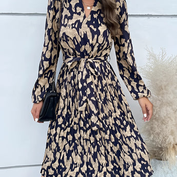 Woman wearing a high-neck long sleeve leopard print dress suitable for trendy fall fashion, showcasing a stylish and chic look.