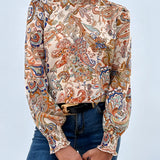 High-neck paisley blouse featuring a bohemian style with long sleeves, suitable for autumn wear.