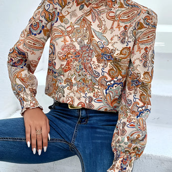 High-neck paisley blouse featuring a bohemian style with a white pattern, long sleeves, and a fitted waist, ideal for autumn fashion.