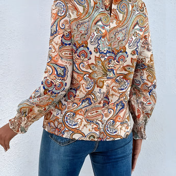 High-neck paisley blouse featuring a stylish bohemian design with long sleeves and a fitted waist, ideal for autumn wear.