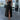 High slit white maxi dress with a strappy back design, displayed in a Nero XL size. The dress features a sleek shoulder line, fitted waist, and a single-piece flowing silhouette.