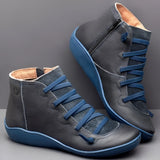 High-top brown leather sneakers featuring a zipper and lace-up design, accented with electric blue details, displayed in size 46.