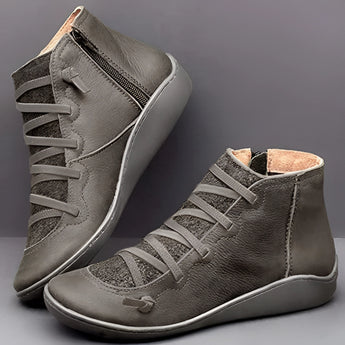 Brown high-top leather sneakers featuring a zipper and lace-up design, with a gray color variant, crafted with a synthetic rubber sole for durability and style.