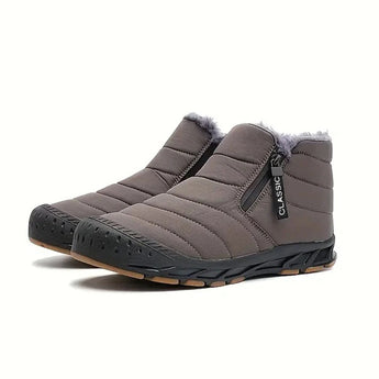 Gray high-traction athletic sneakers with anti-slip rubber soles designed for walking and sportswear.