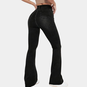 High-waist black flare jeans made from vintage stretch denim, showcased on a woman highlighting the waist, legs, and thighs.
