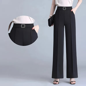 Wide-leg black trousers with a high waist, styled for formal business occasions, paired with a grey dress shirt.
