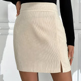 High Waist Ribbed Mini Skirt in a black and white tartan pattern, styled for a casual chic autumn look, paired with outerwear showcasing shoulders and legs.