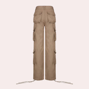 High-waisted beige wide-leg women's utility cargo pants displayed on a wooden hanger, showcasing the design and features such as the loose fit and utility pockets.