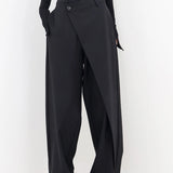 High-waisted black slim fit women's business trousers showcasing a sleek design with a fitted silhouette, emphasizing the waist and tapering down through the leg.