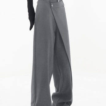 High-waisted black slim fit women's business trousers, styled with a formal look, showcasing the waist and thigh area.