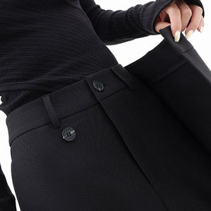 High-waisted black slim fit women's business trousers being worn, showcasing the waist and leg fit, paired with a formal shirt and blazer.