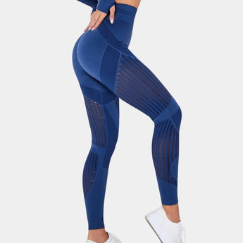 High-waisted blue geometric yoga pants in XL size, featuring a breathable and stretchable fabric designed for activewear, shown on a person demonstrating flexibility in a yoga pose.