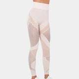 High-waisted geometric yoga pants featuring a breathable and stretchable fabric, designed for activewear, shown being worn by a person.