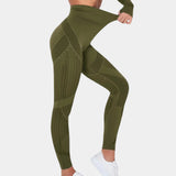 High-waisted geometric yoga pants in green, size XL, designed with breathable and stretchable fabric for activewear, showcasing details such as waist and leg areas.