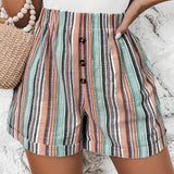 High waisted women's summer shorts with a multicolor striped pattern and button front design, showcasing the waist and thigh areas.