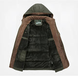 Brown hooded winter jacket featuring textured fabric, beige collar, and brown suede patches on the sleeves and pockets.