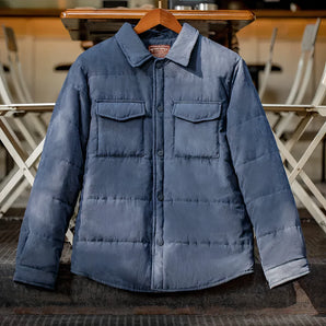 Men's insulated quilted vintage denim jacket in a winter overshirt style, featuring a grey color with a classic collar and long sleeves.