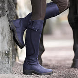 Insulated waterproof leather riding boots in purple, size 43, designed for thermal winter equestrian activities. The boots are shown on a model, highlighting their sleek design and comfortable fit extending up to the knee.