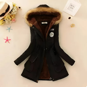 Insulated women's black parka with a fur-lined hood, featuring long sleeves and a tailored fit, designed for winter wear.