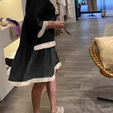 Ivory boho chic lace trim tunic dress featuring short sleeves and knee-length design, styled with a casual bag.