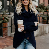 Ivory chunky knit sweater with a buttoned cowl neck, displayed in a blue 3XL size, showcasing its oversized design ideal for women's fashion. The photograph highlights the garment's texture and style, emphasizing the long sleeves and cozy fit.