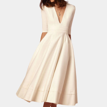 Ivory elegant A-line midi dress with a formal boat neck and half sleeves, in beige color and extra-large size, highlighting the waist with a sophisticated design.