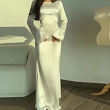 Ivory long sleeve satin gown with elegant shoulder design, fitted waist, and thigh-length skirt, suitable for formal evening or wedding, shown in white and size 3XL.