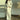 Ivory long sleeve satin gown with elegant shoulder design, fitted waist, and thigh-length skirt, suitable for formal evening or wedding, shown in white and size 3XL.
