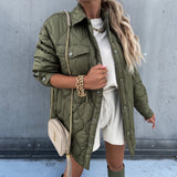 Oversized ivory puffy winter jacket for women, shown in a green color variant, featuring a lightweight quilted design with long sleeves and a high neck, modeled by a standing individual.