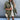 Oversized ivory puffy winter jacket for women, shown in a green color variant, featuring a lightweight quilted design with long sleeves and a high neck, modeled by a standing individual.
