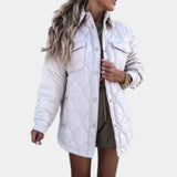 Ivory oversized women's puffy winter jacket featuring a lightweight quilted design. The jacket has a collar, long sleeves, and a relaxed fit with attention to shoulder and waist areas, suitable for cold weather.