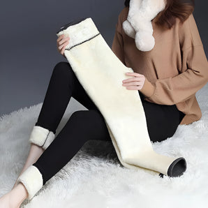 Ivory plush lined tall fur boots for women, featuring a luxurious and cozy design suitable for winter.