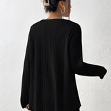Ivory ribbed crew neck women's sweater with long sleeves, worn by a woman with shoulder-length hair, showcasing a casual yet chic fall fashion style.