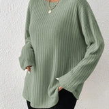 Ivory ribbed crew neck women's sweater with long sleeves, showcasing a casual chic fall fashion style.
