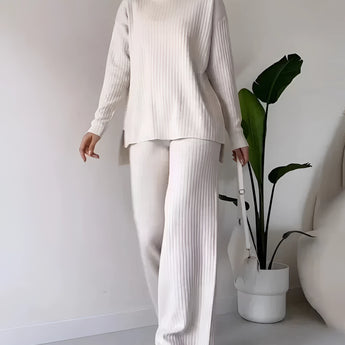 Ivory ribbed knit sweater and pants set for women in a monochrome style, shown in white and size XXL, featuring a round neck, long sleeves, and a comfortable fit around the waist and knees.